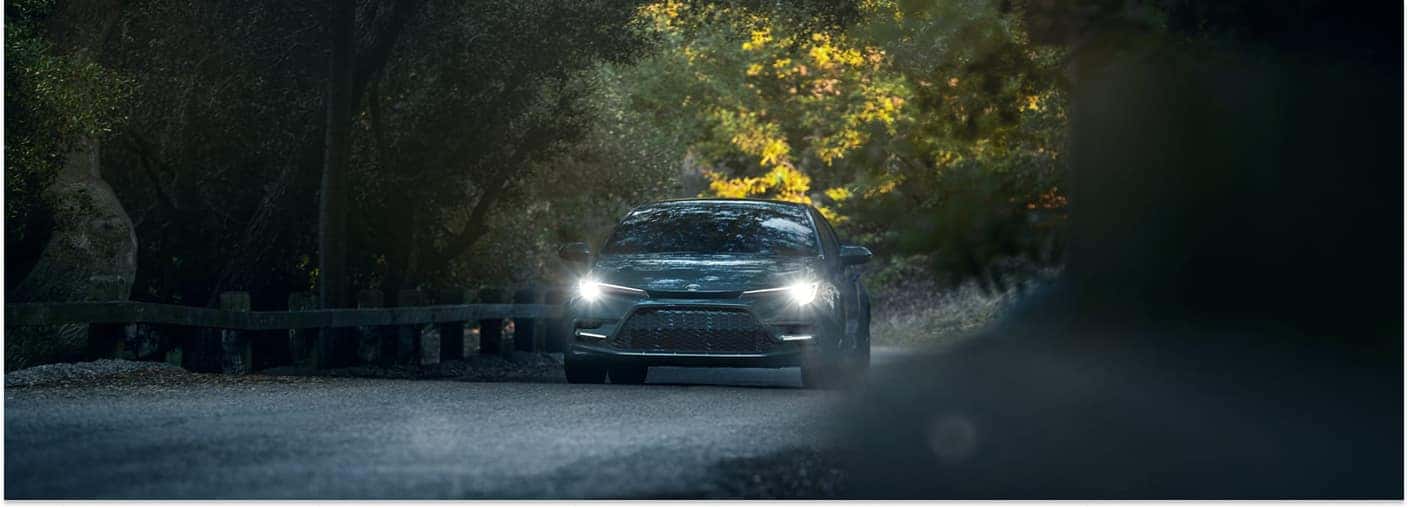 2026 Toyota Corolla Driving on Road at Dusk