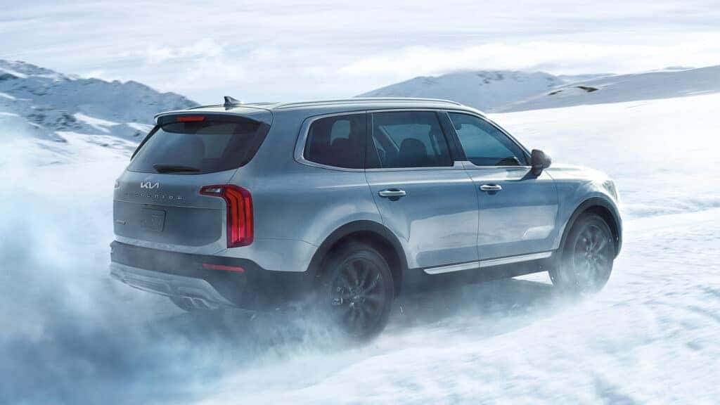 The Kia Telluride driving through snow